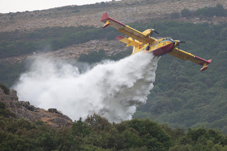 Firefighters battle wildfires raging across south-west Sardinia